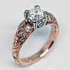 Ideal cut diamond. Delicate hand engraving with organic motifs flows with blue sapphires, emeralds, and diamonds engagement ring