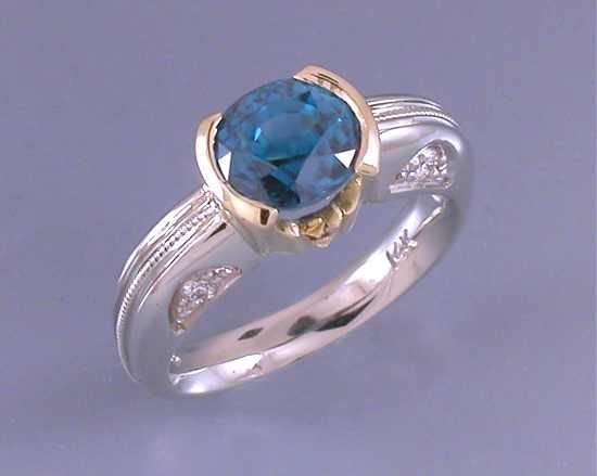 custom-white-and-yellow-gold-sapphire-and-diamond-engagement-ring.jpg