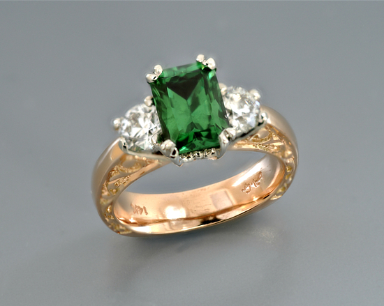 custom-white-and-yellow-gold-three-stone-tsavorite-garnet-diamond-engraved-engagement-ring.jpg