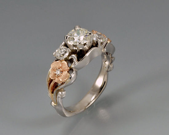 custom diamond engagement ring set in white and rose gold floral Euro shank