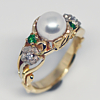 Akoya 8.1 mm pearl 14k two-tone gold with green tsavorite garnets and diamonds