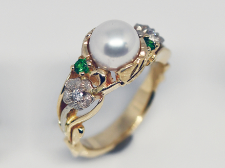 Akoya 8.1 mm pearl 14k two-tone gold with green tsavorite garnets and diamonds