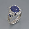 Blue Star Sapphire platinum ring with diamond halo