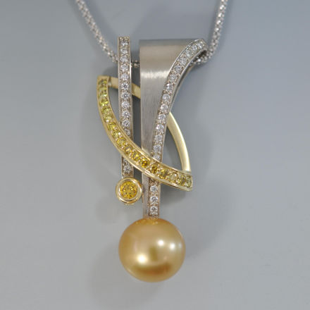 Golden South Sea Pearl 13.5mm pendant with three brilliant arcs of striking white and yellow diamonds set in 18k white and yellow gold