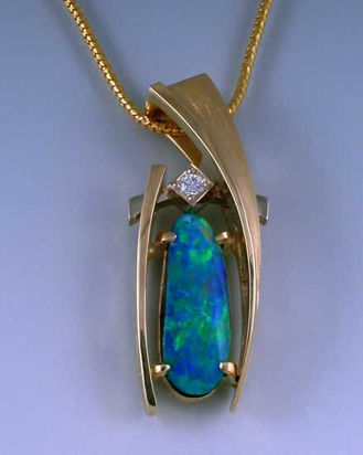 Black opal with Diamonds in 14k white and yellow gold